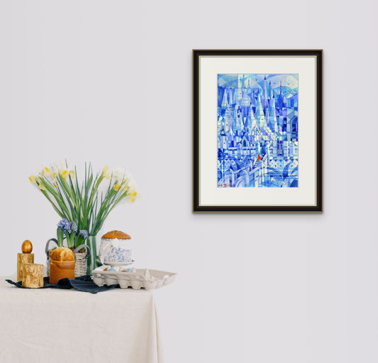 Framed blue abstract cityscape artwork with geometric towers and buildings.
